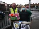 President Julian receiving a donation of 138 mince pies from Mel at Morrisons